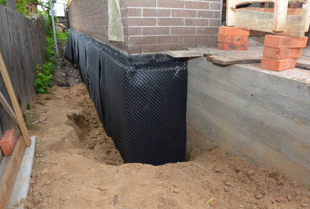 Happy homeowners after waterproofing job in Prairieton